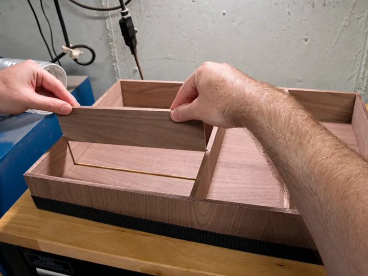 Fitting the walnut organizer panels together during glue-up