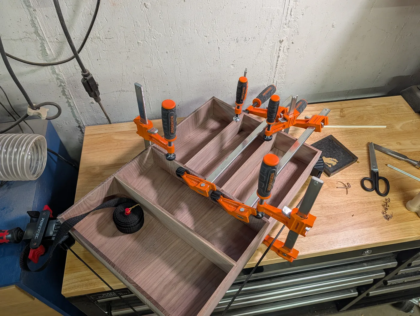 Overhead view of the walnut organizer clamped around its sides and dividers
