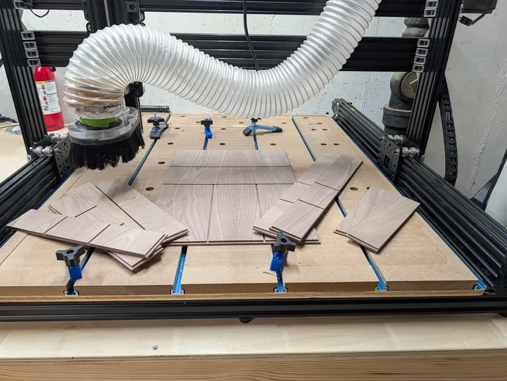 Drawer organizer parts after the CNC toolpaths finished cutting
