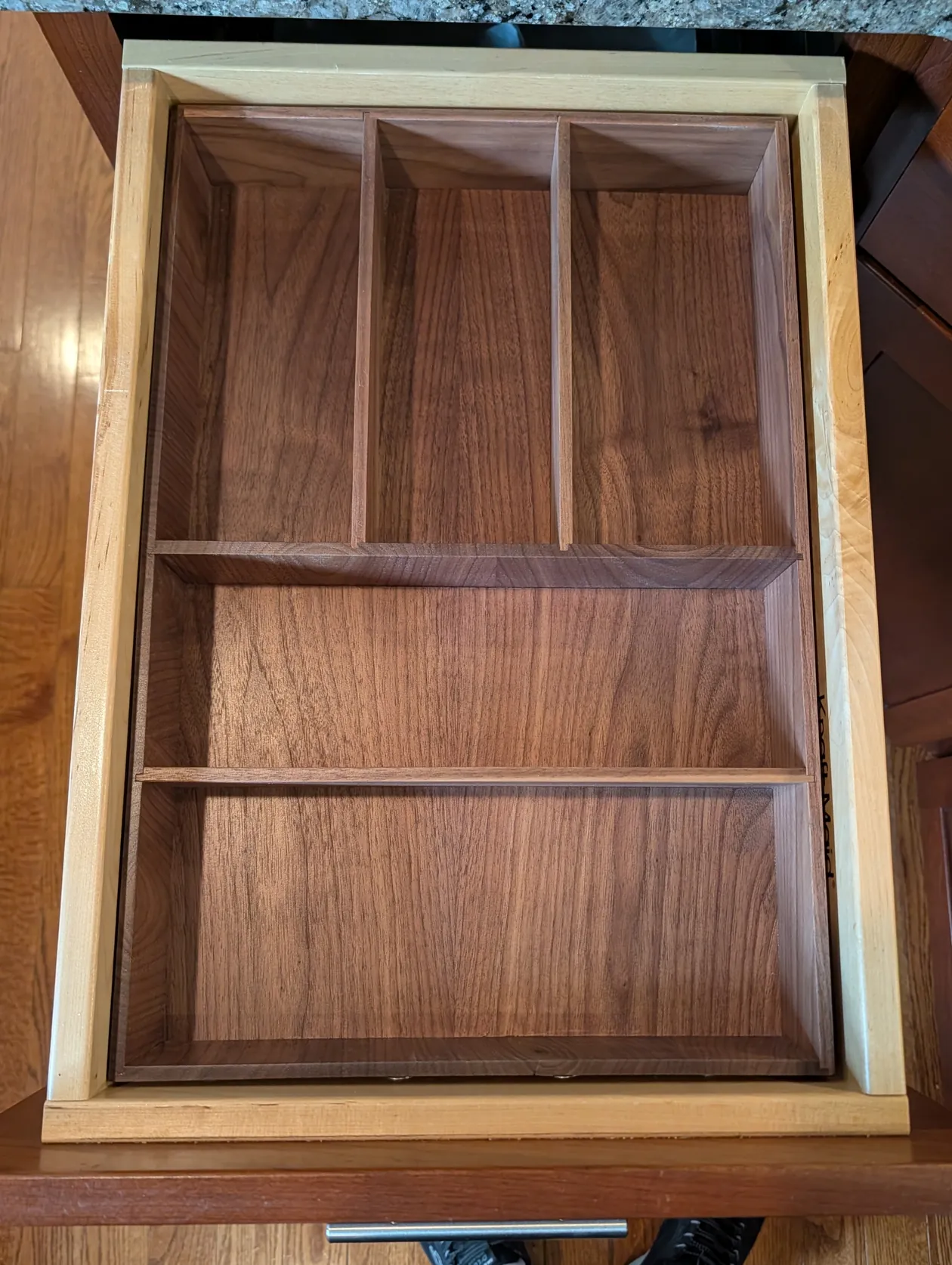 Finished walnut organizer fitted inside the kitchen drawer
